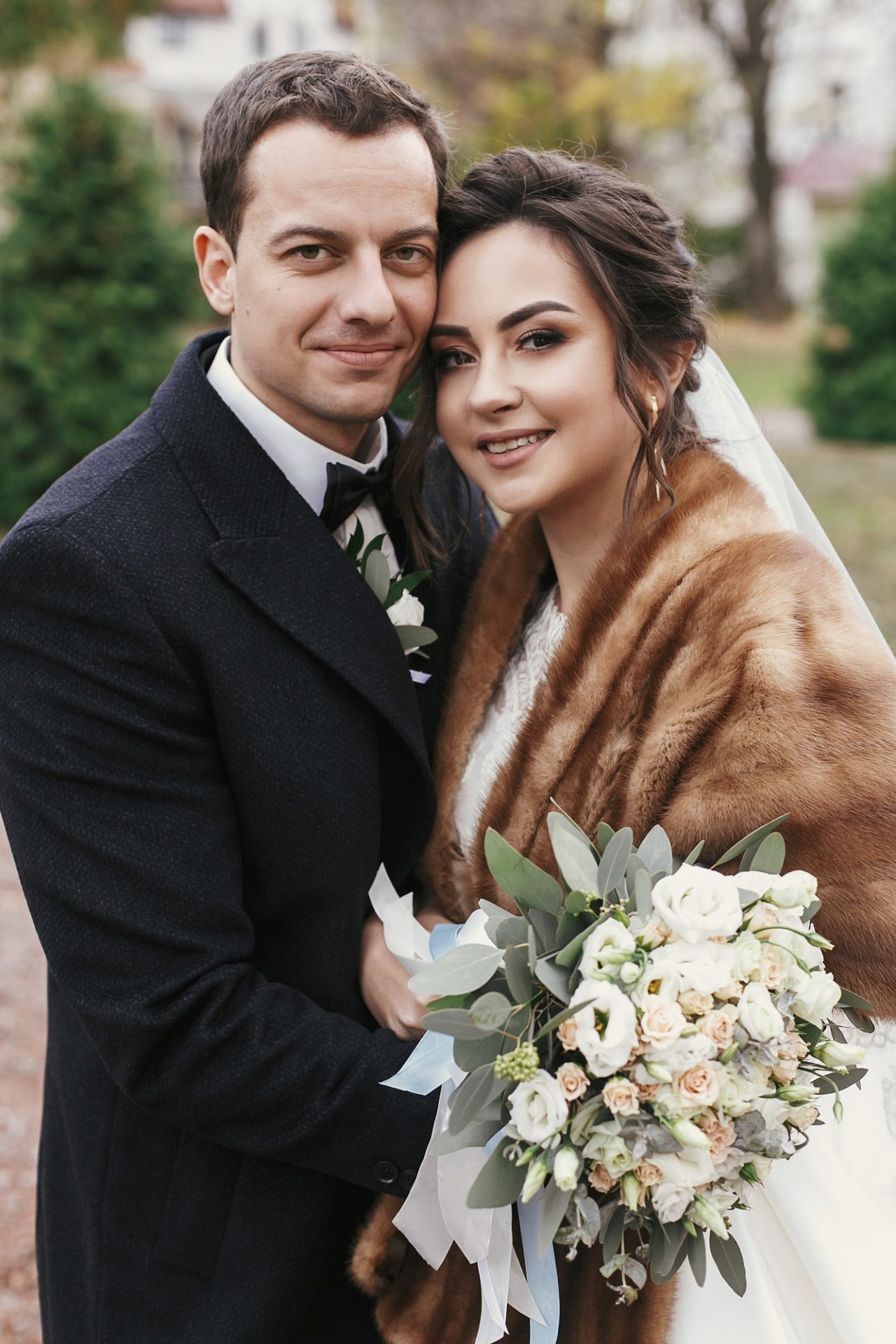 gorgeous-bride-with-bouquet-and-stylish-groom-gently-hugging-e1611801870448.jpg