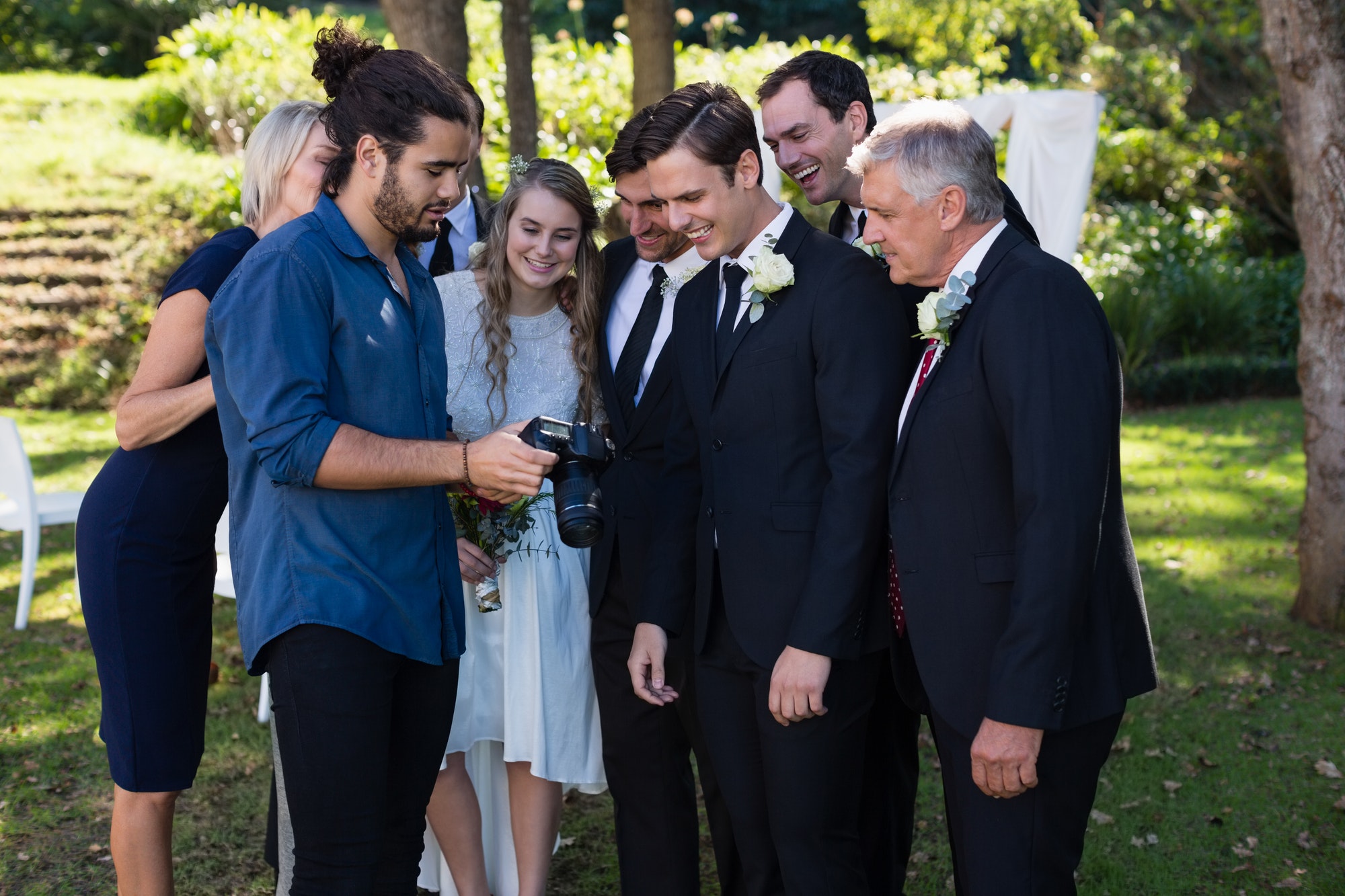 photographer-reviewing-photographs-on-digital-camera.jpg